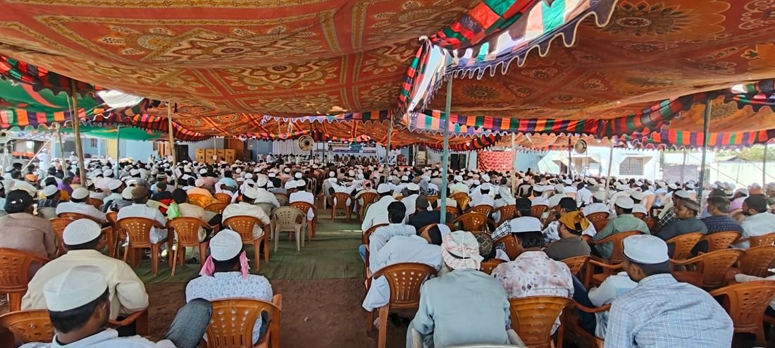 Community gathering under tent